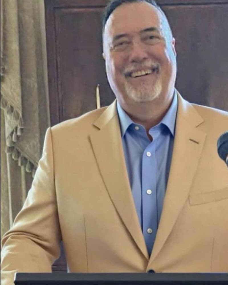 Portrait of Dr. Ed Shoemaker, State Committeeman of the Polk County Republican Executive Committee, speaking at a podium