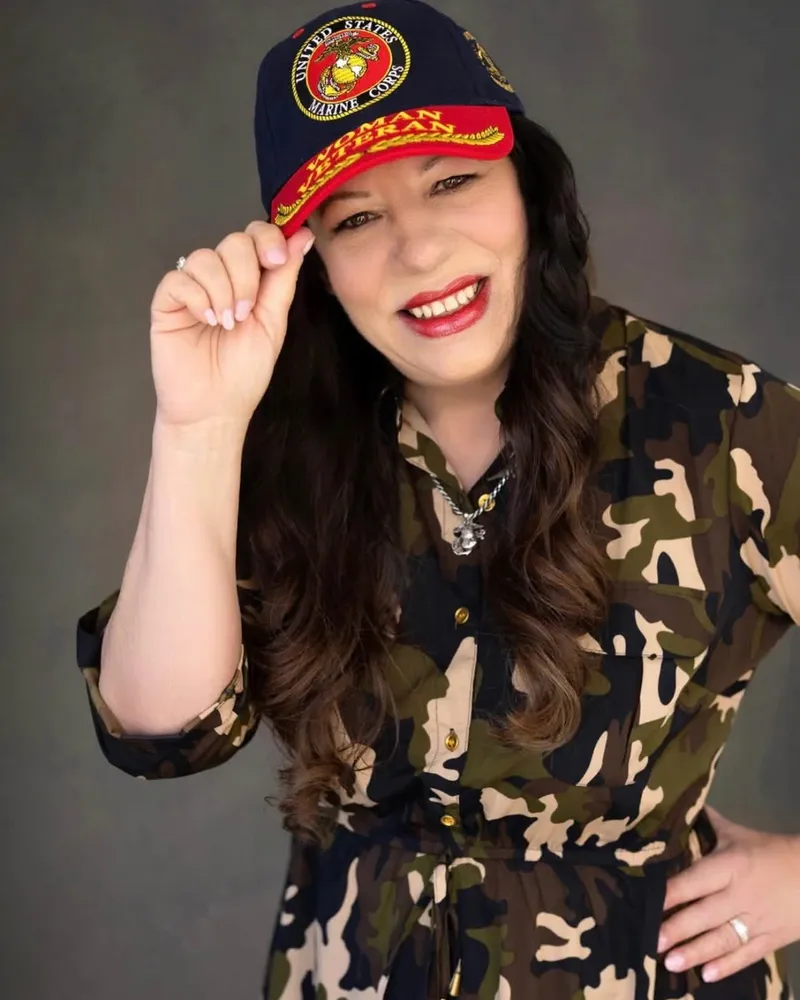 Portrait of Kat Gates-Skipper, State Committeewoman of the Polk County Republican Executive Committee, wearing a United States Marine Corps woman veteran cap